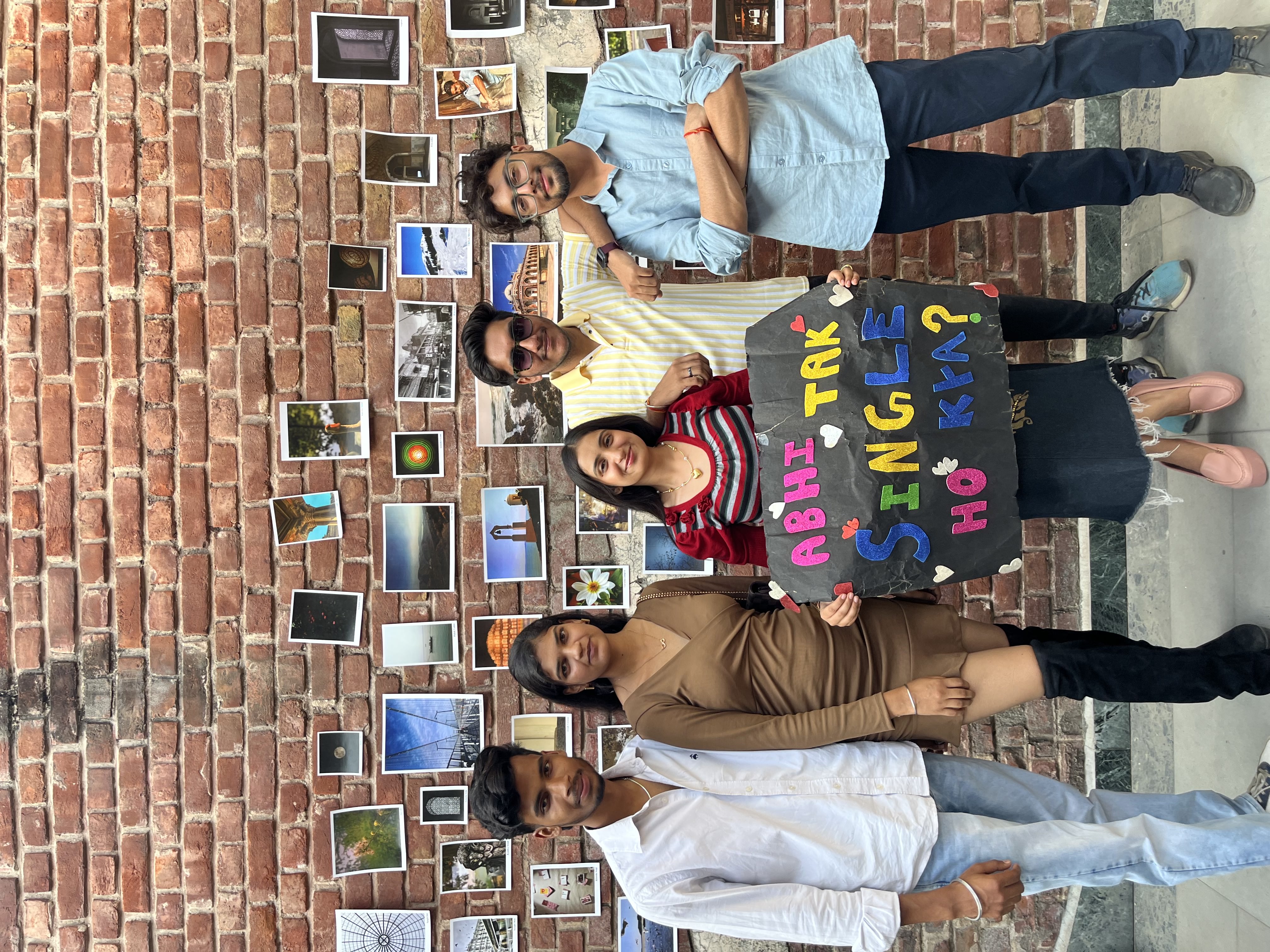 Campus event with students holding colorful signs